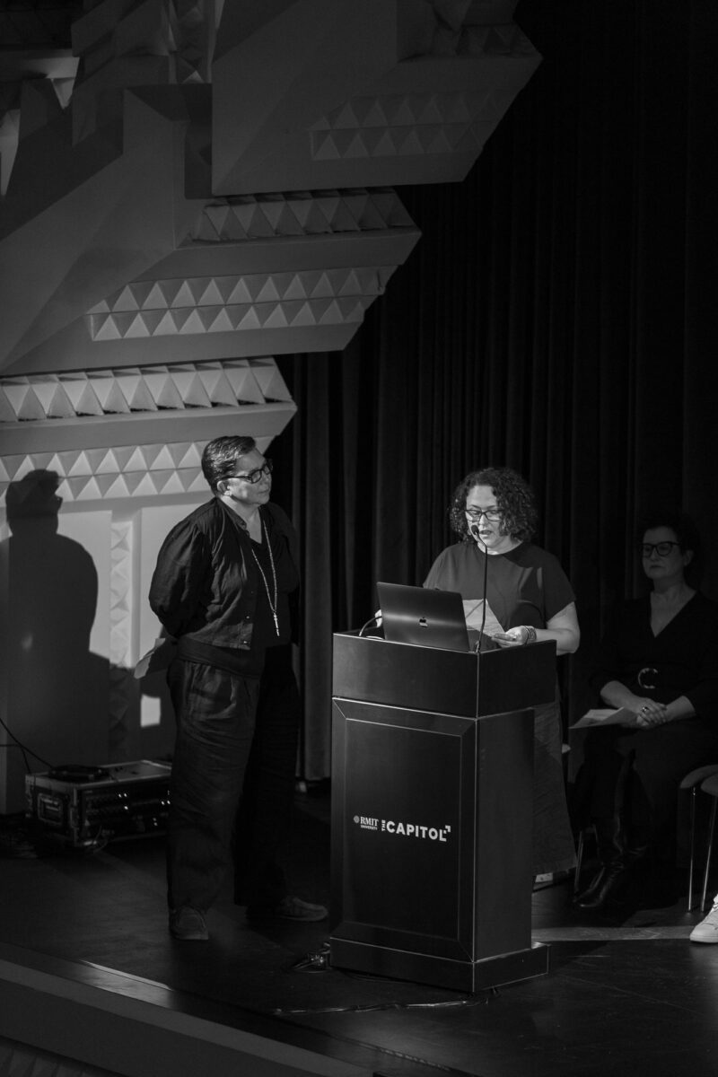 Two people present research at the Capitol.