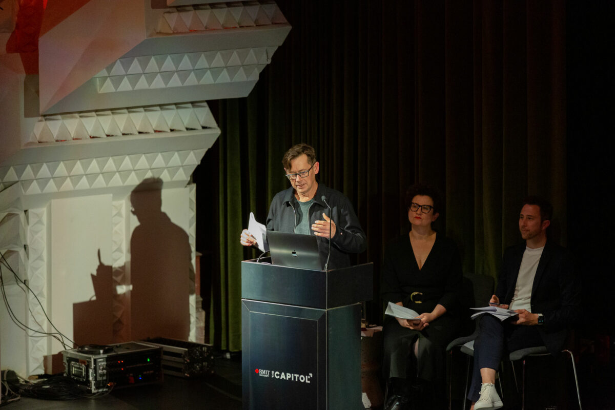 A man delivers a speech at a podium.