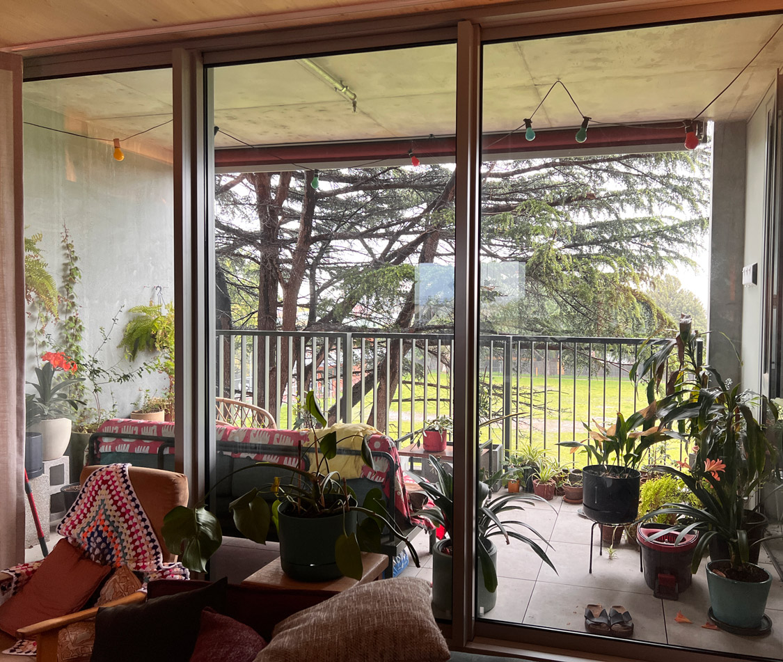 A photo of a balcony overlooking the park.