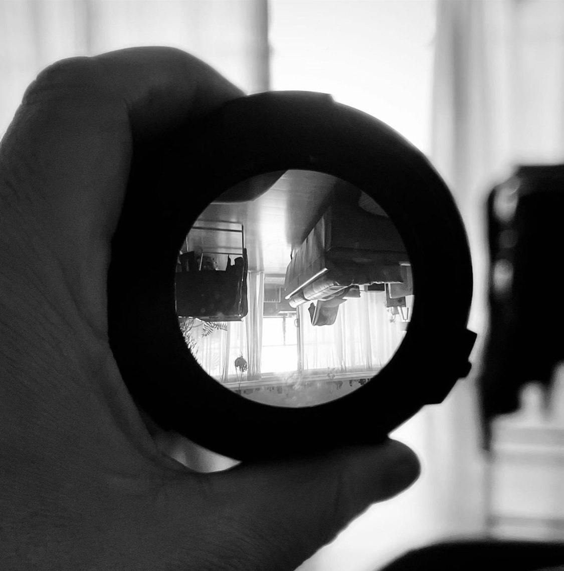 A close-up photo of a camera lens that turns what you're looking at upside down.