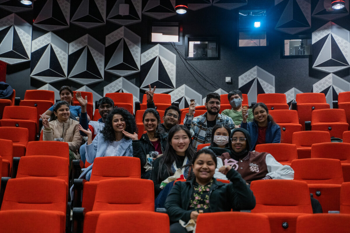 Students sitting in an auditorium.