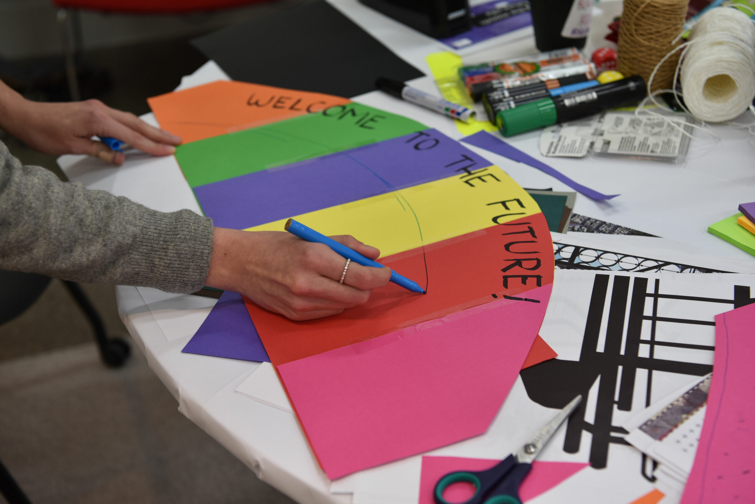 Coloured card arranged as a rainbow.