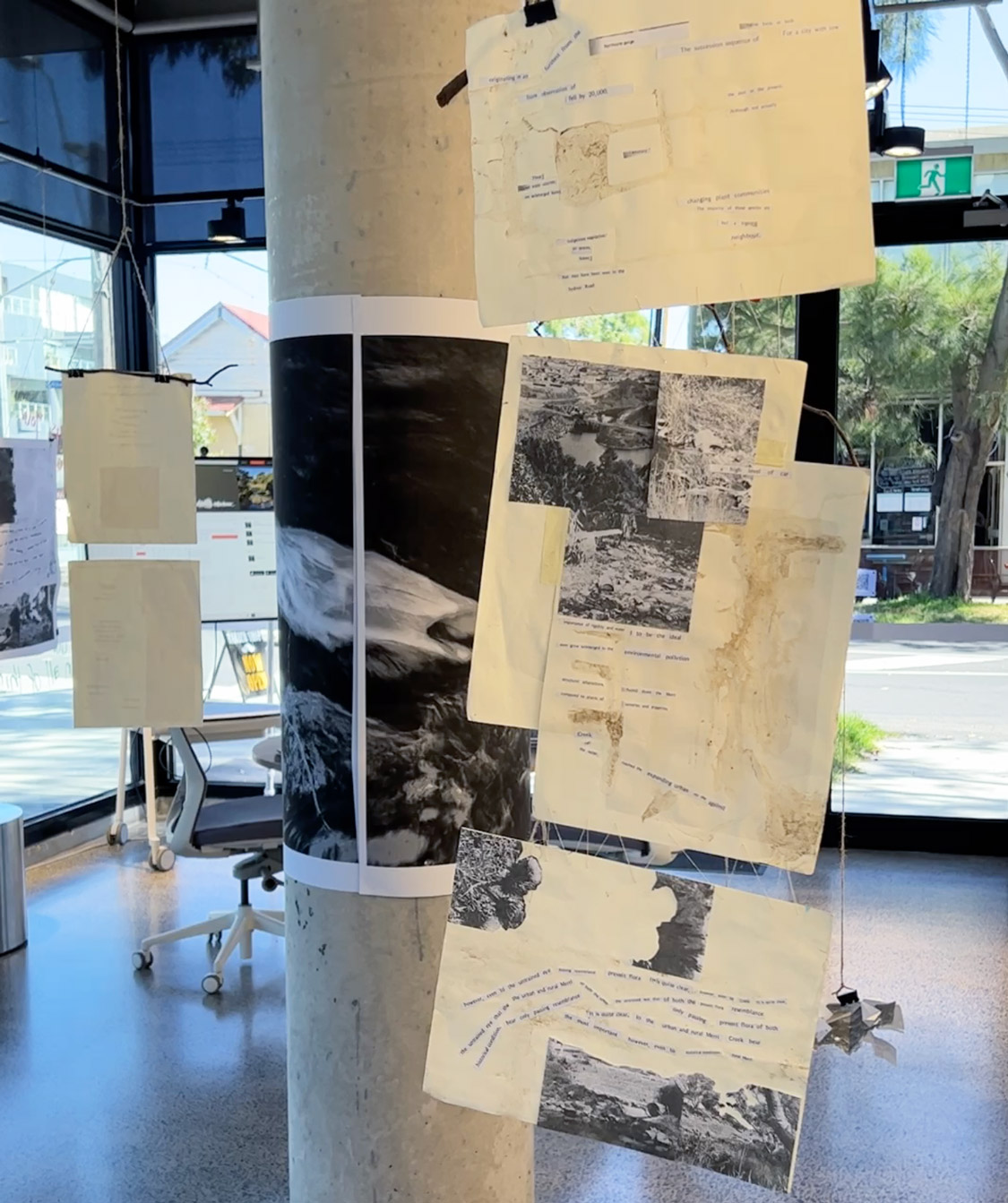 Posters hanging from the ceiling.