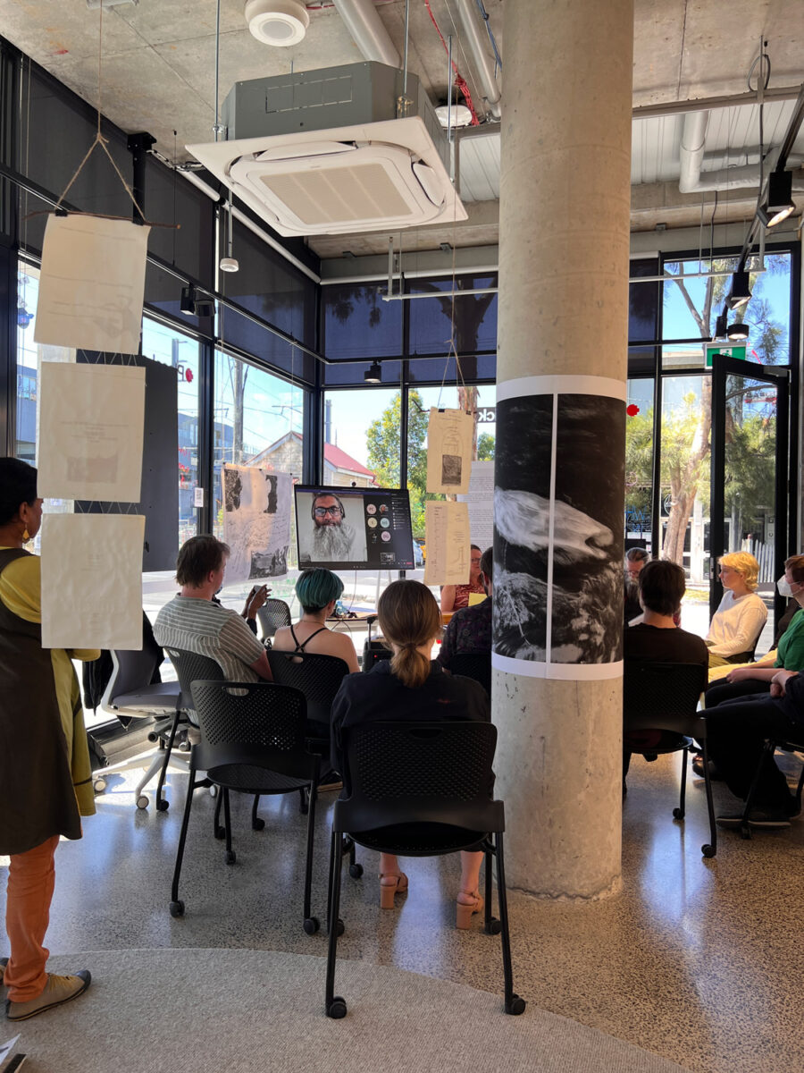 Students sitting in PlaceLab talking.